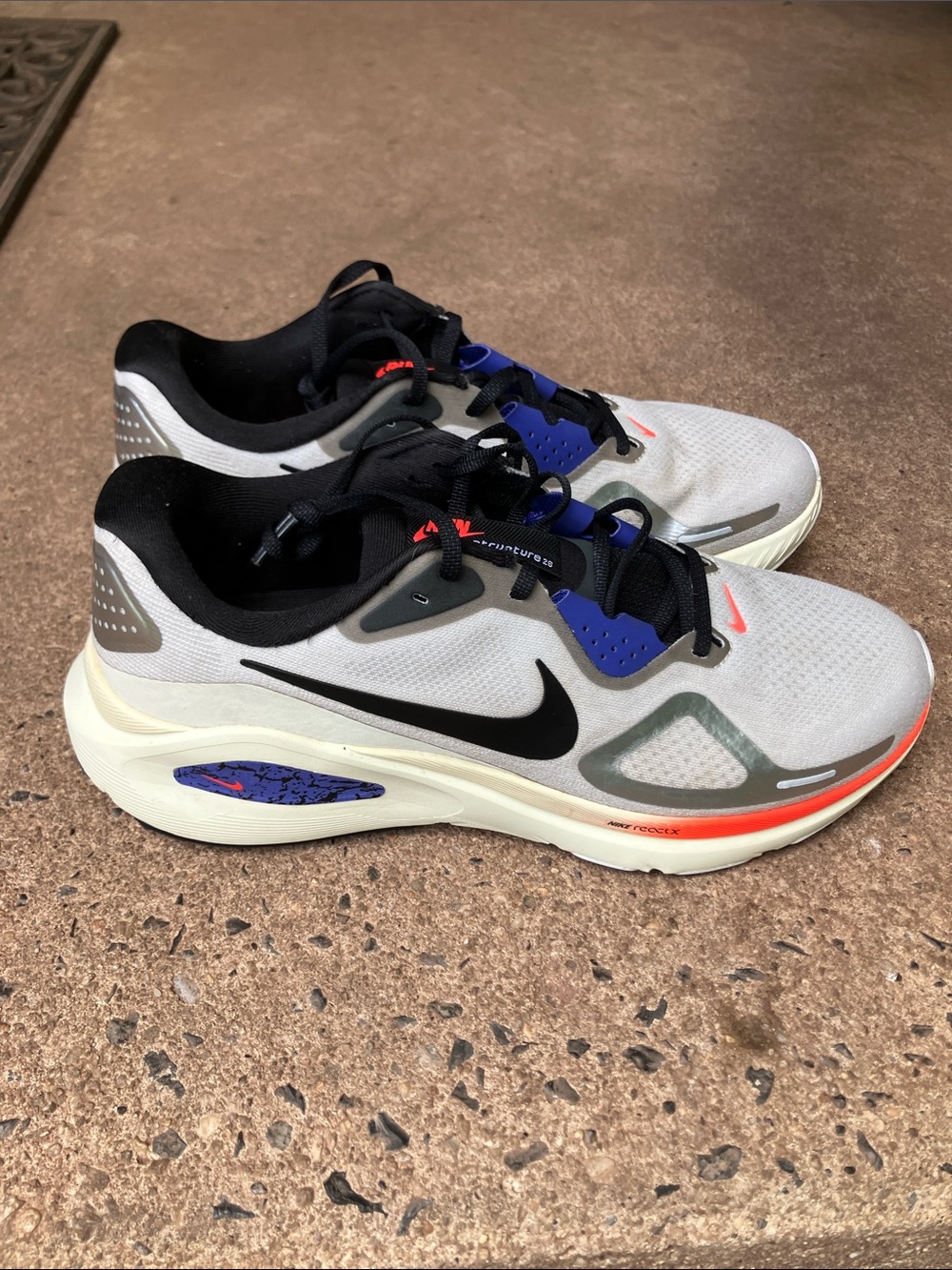 Nike Men's Gray Running Shoes with Black Swoosh and Blue Accents